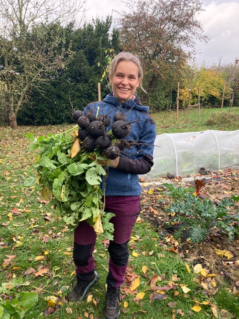 Tini Vogt holding produce from her garden